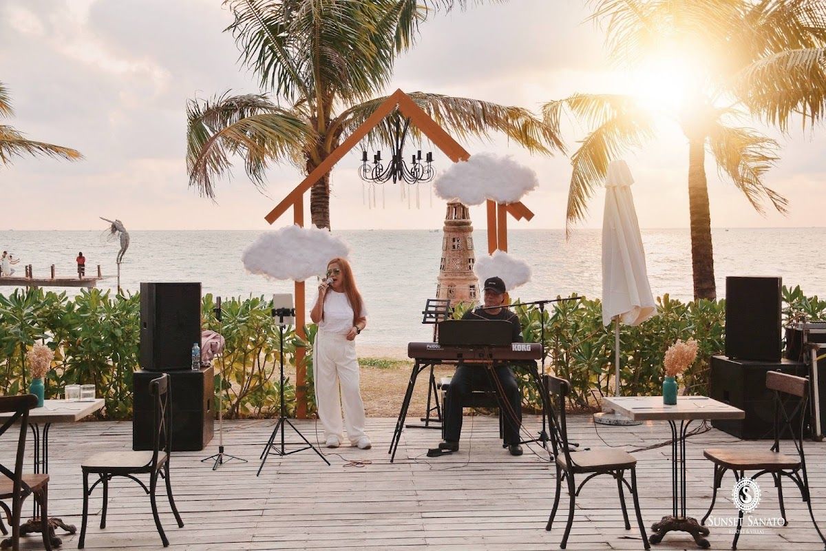 Sunset Sanato Beach Club — the most booked sunset spot on the island's west coast Sunset Sanato Beach Club on Long Beach, with art installations and beachfront seating at dusk